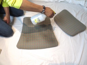 Spray fine mist of water to upholstery pieces